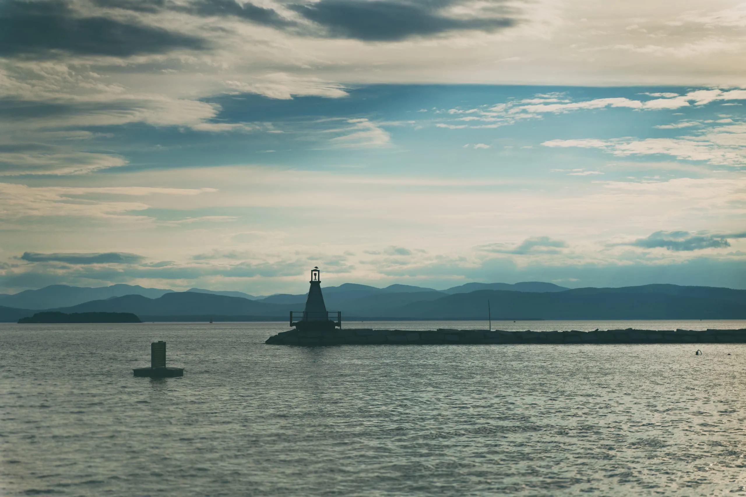 Small breakwater lighthouse at dusk on Lake Champlain, Burlington