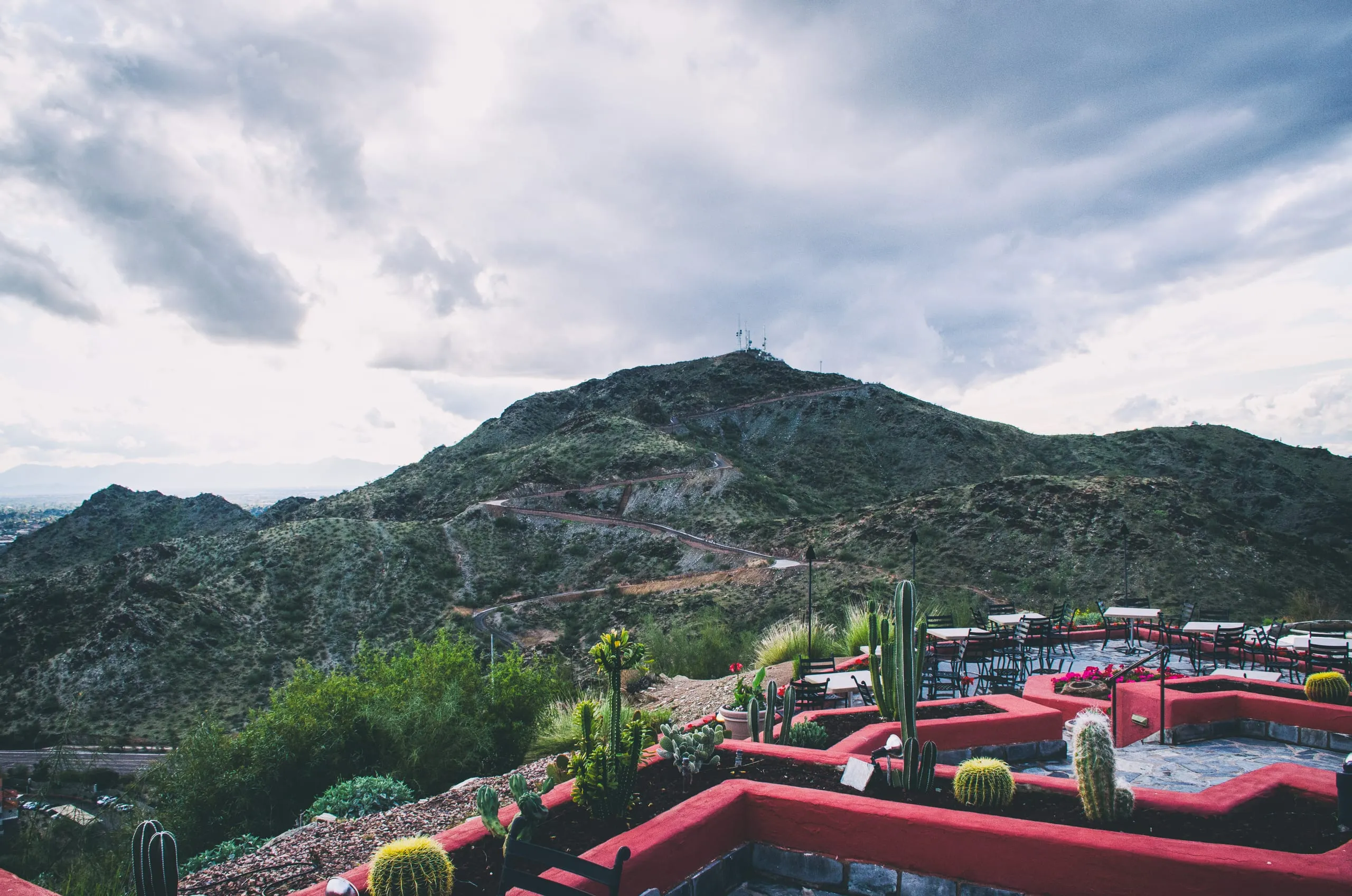 Desert resort terraces stepping down a hillside in moody light near Phoenix